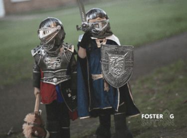 Two children dressed up as medieval knights