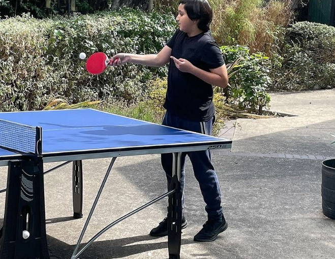 Volunteer playing table tennis