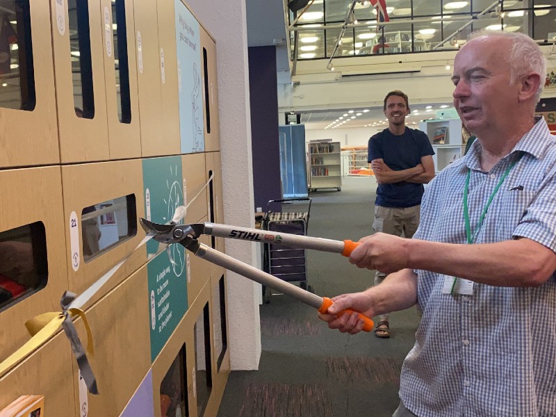 Councillor Lewis cutting the ribbon at the Library of Things