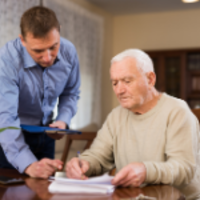 photo of person helping older person