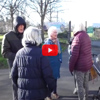 photo of residents meeting in a park