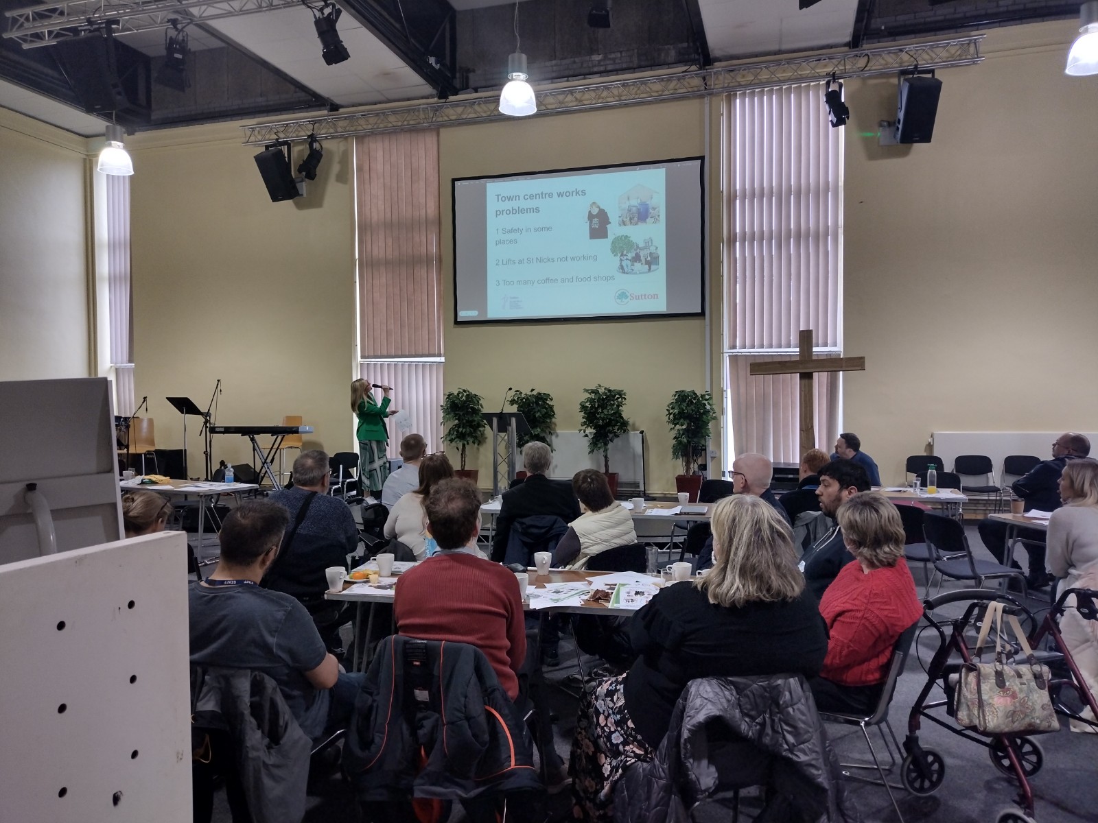 Andrea speaking on stage at Learning Disabilities Conference with audience watching