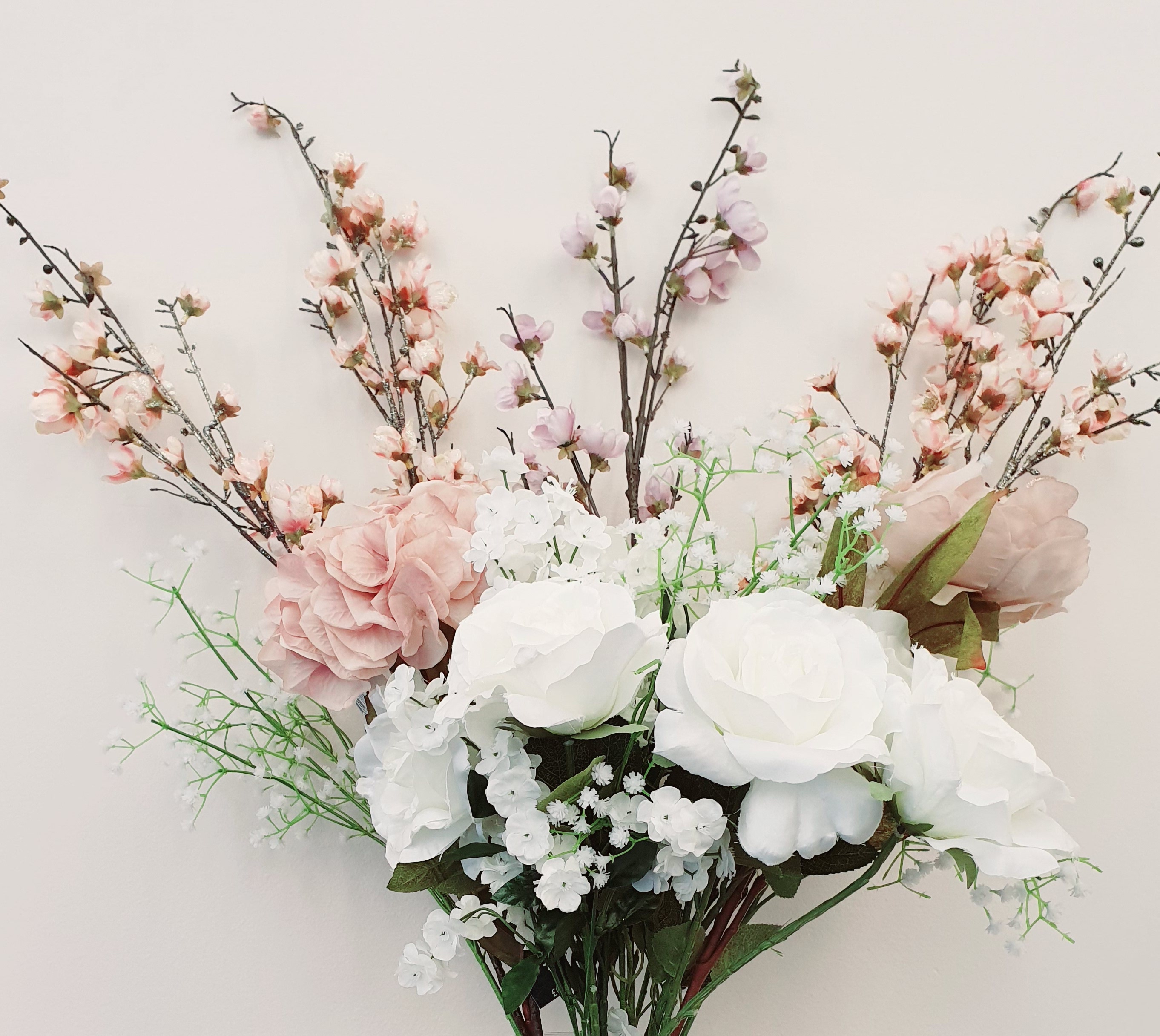 white and pink flowers in a glass vase