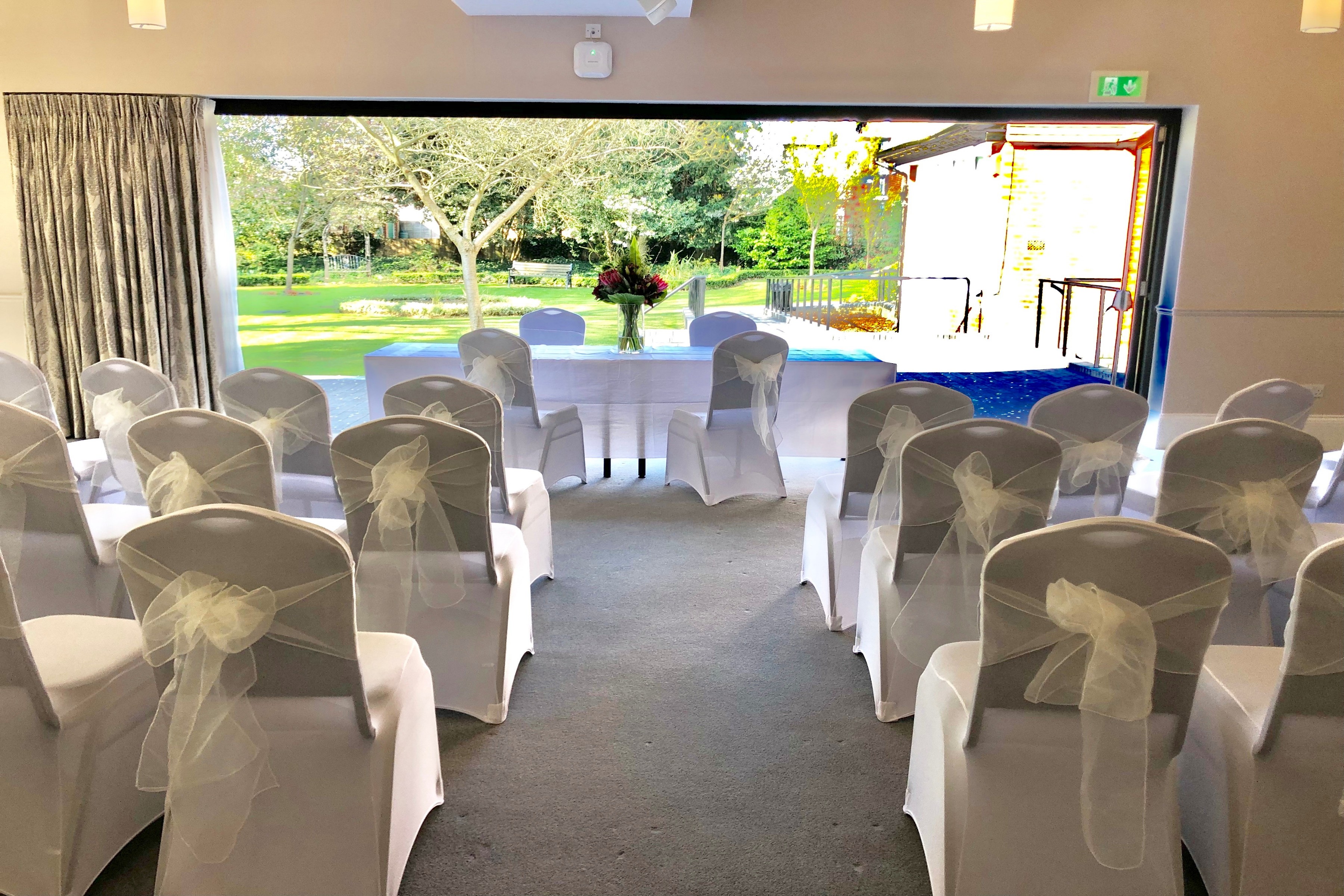 Ceremony room with rows of white chairs