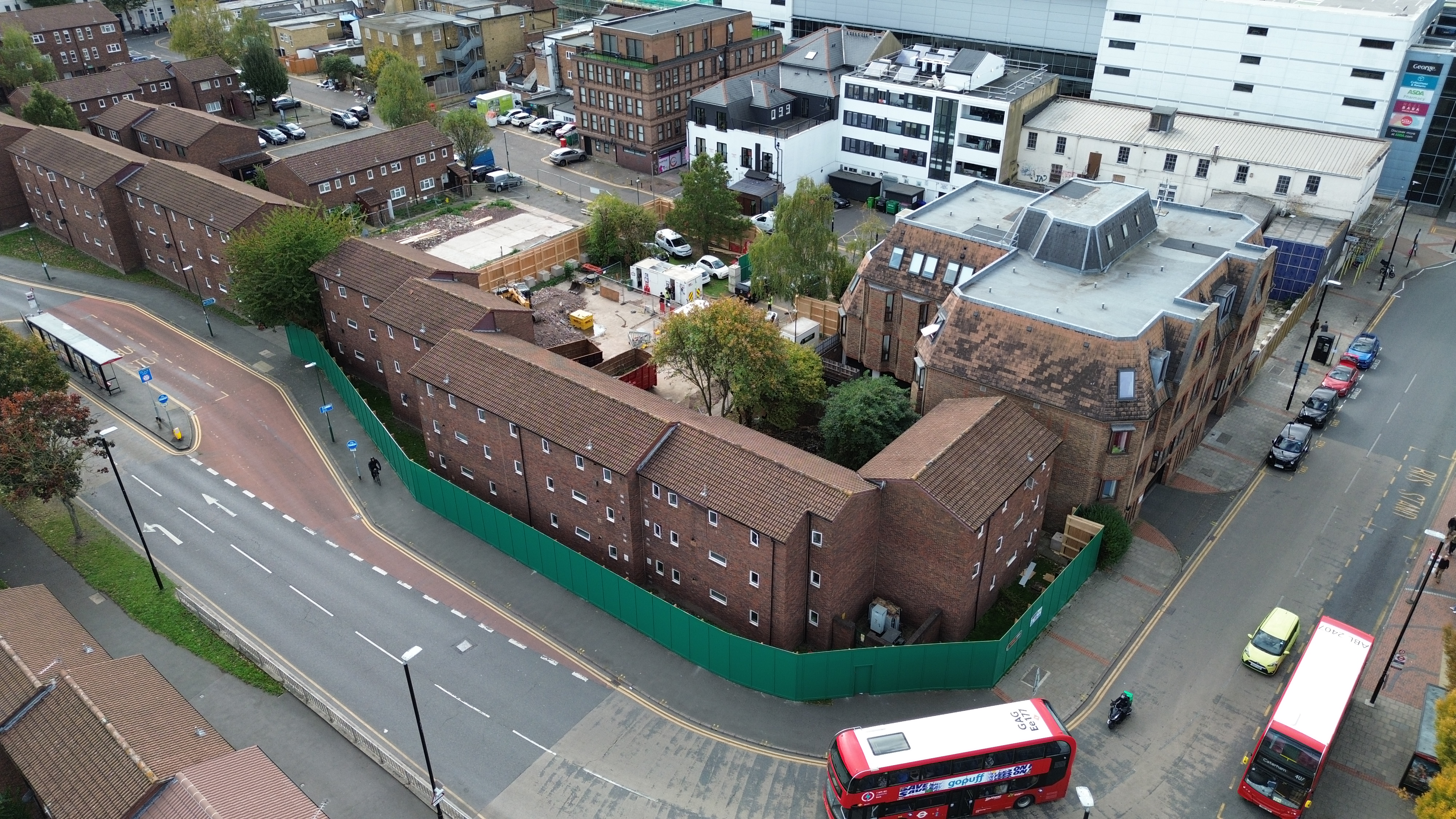 The picture shows an aerial view of the Elm Grove site. It shows that some buildings have been demolished and hoarding around the site.