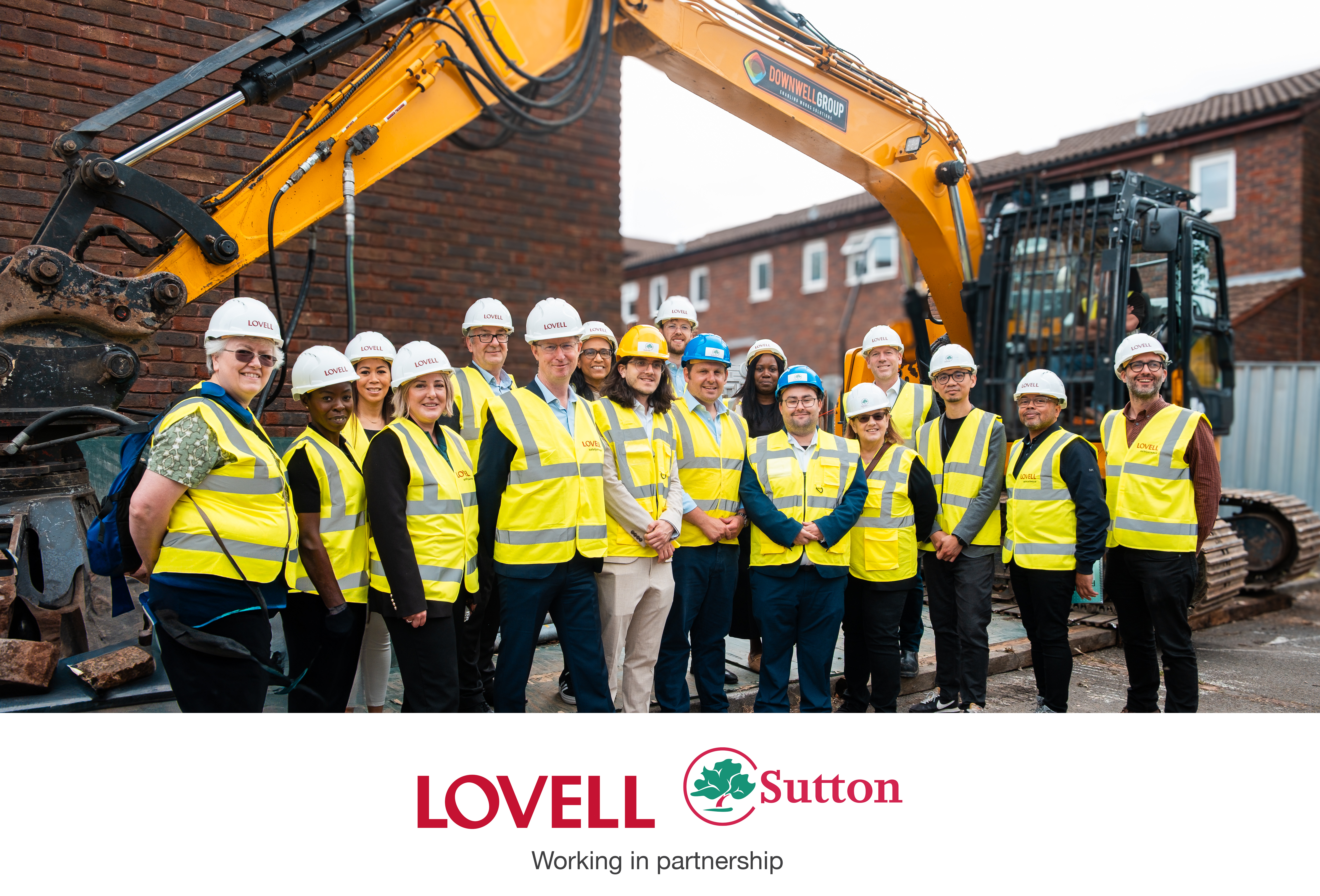 Elm Grove regeneration key stakeholders stading next to digger