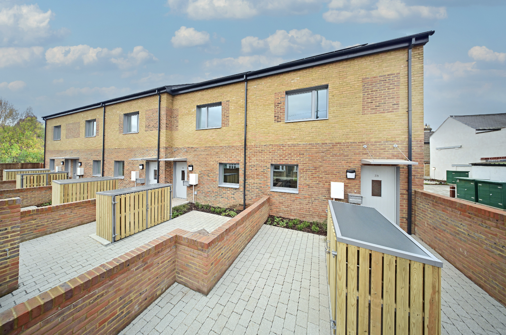 This image shows the 5 completed houses that are part of the Beddington Lane housing development.